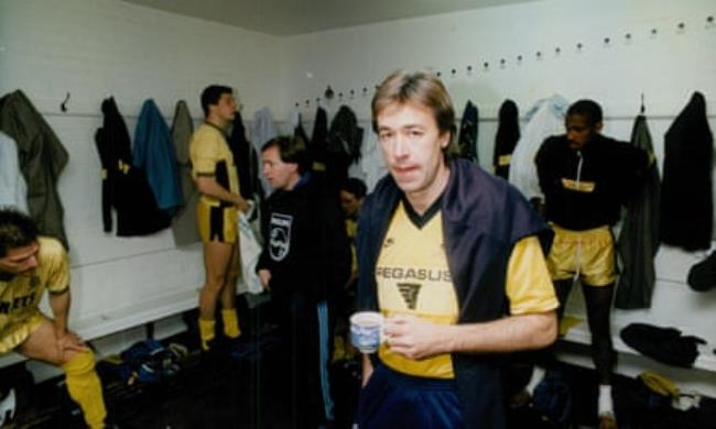 John Beck with a mug tea in the Cambridge United dressing room